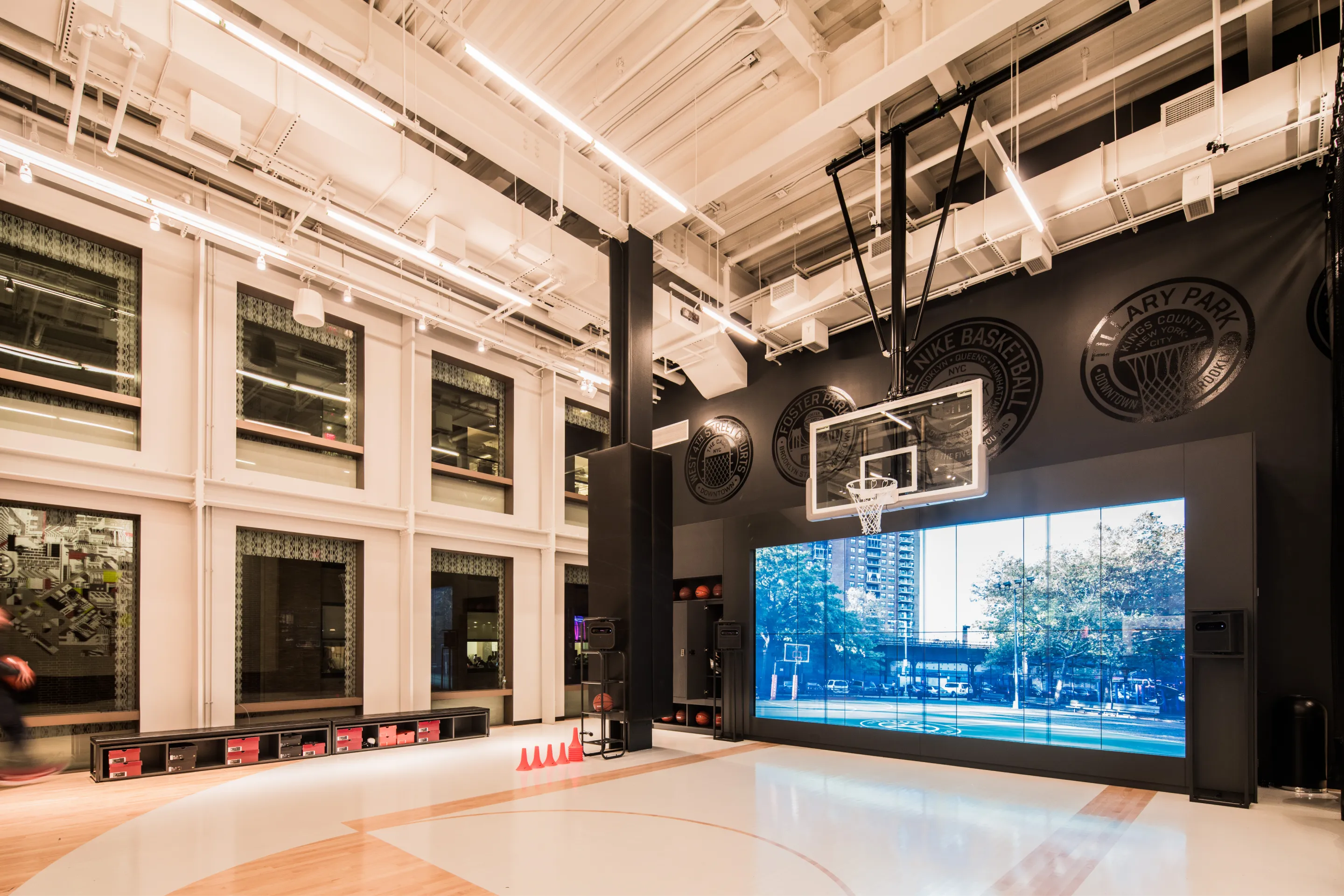 Immersive Interactive Trial Zone Experience in the Nike Flagship Soho Store with wall-sized screen and basketball court